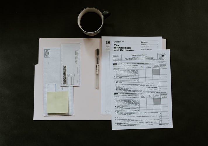 Tax forms in a folder.
