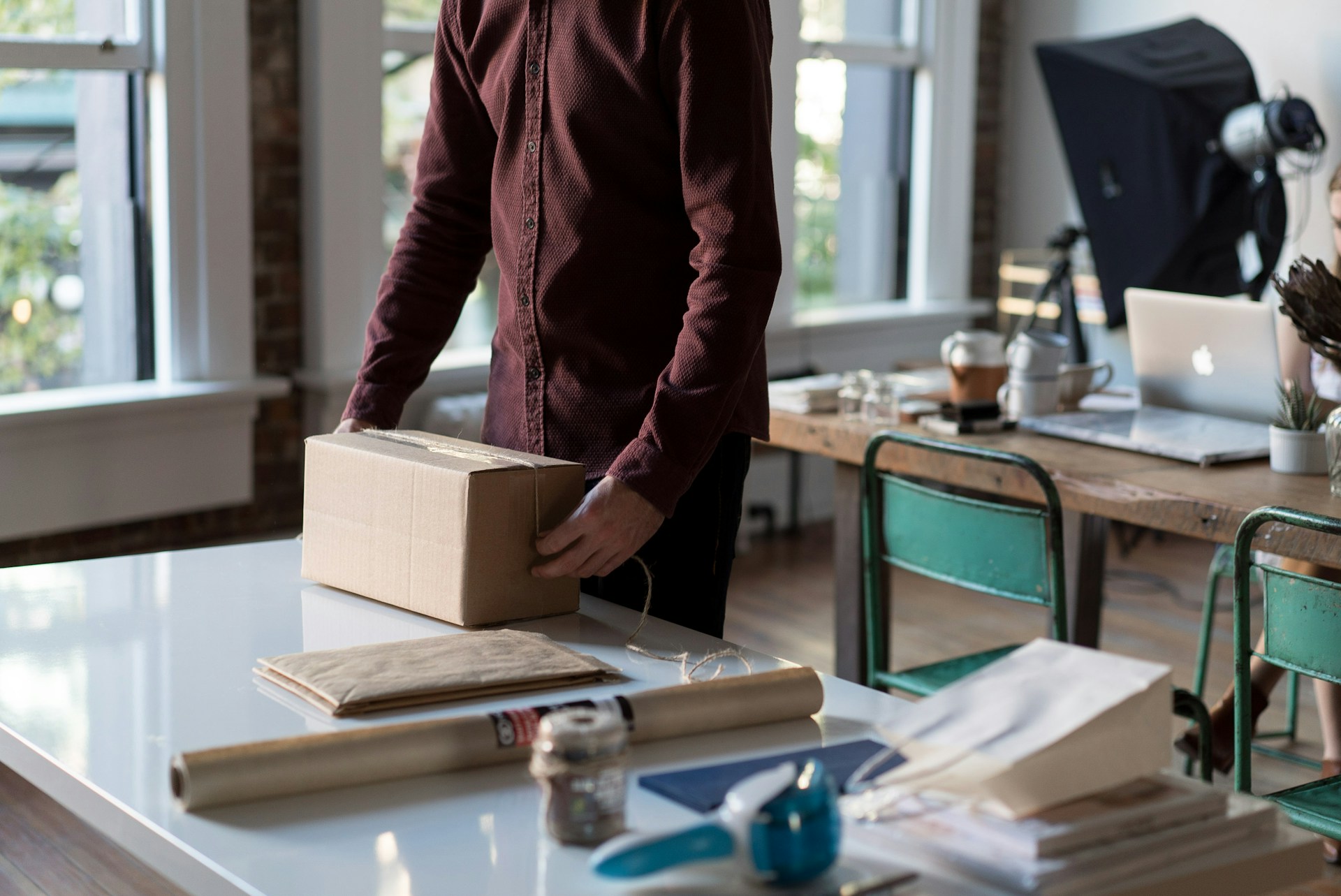 A person packing up fragile belongings
