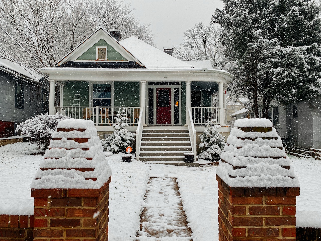 A house under a lot of snow.